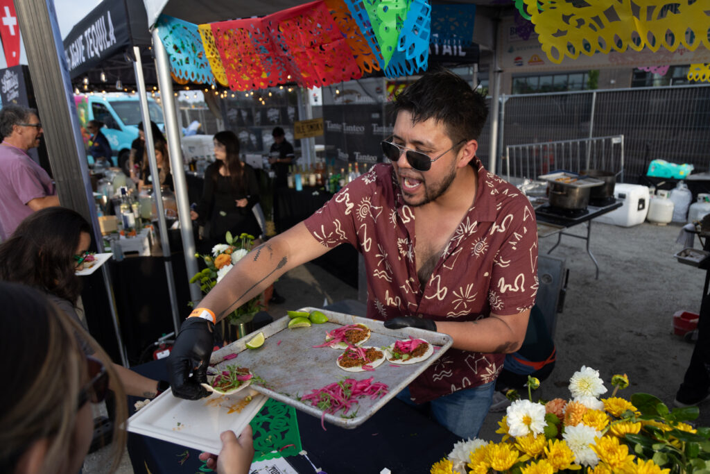 Man serving tacos